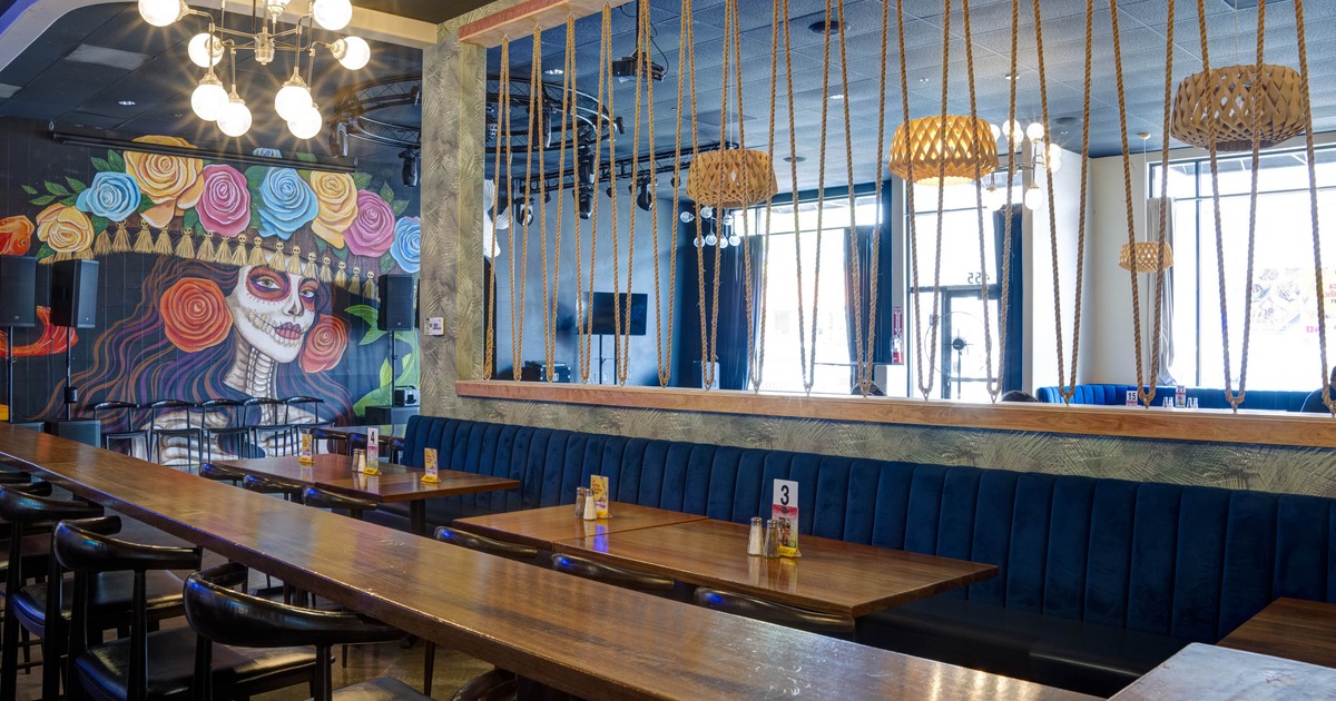 Interior, tables, chairs and stools ready for guests