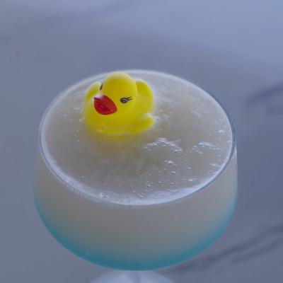 Duck Duck Razz cocktail with a mini rubber duck toy garnish.