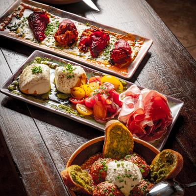 Assorted appetizers arranged across three serving boards.