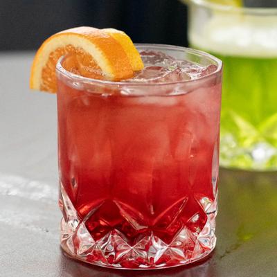 Tiger Tini cocktail, garnished with citrus slices.