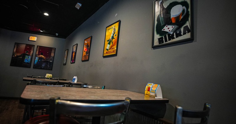 Interior, dining area, framed pictures on the wall