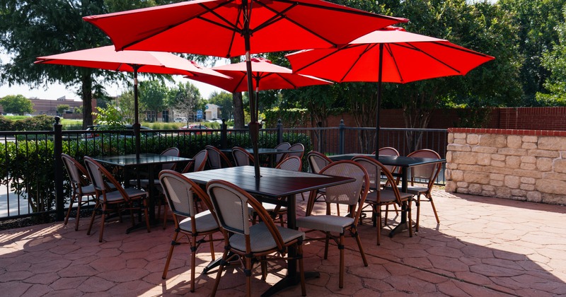 Exterior, terrace, tables, armchairs, parasols