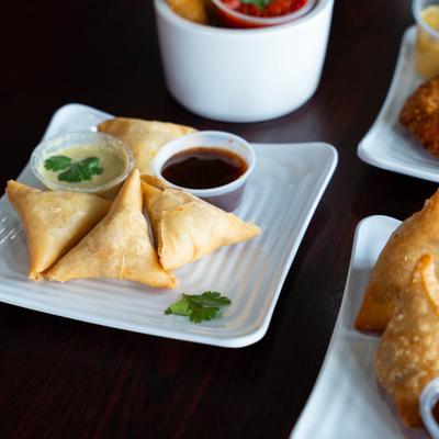 Samosas served with dip.
