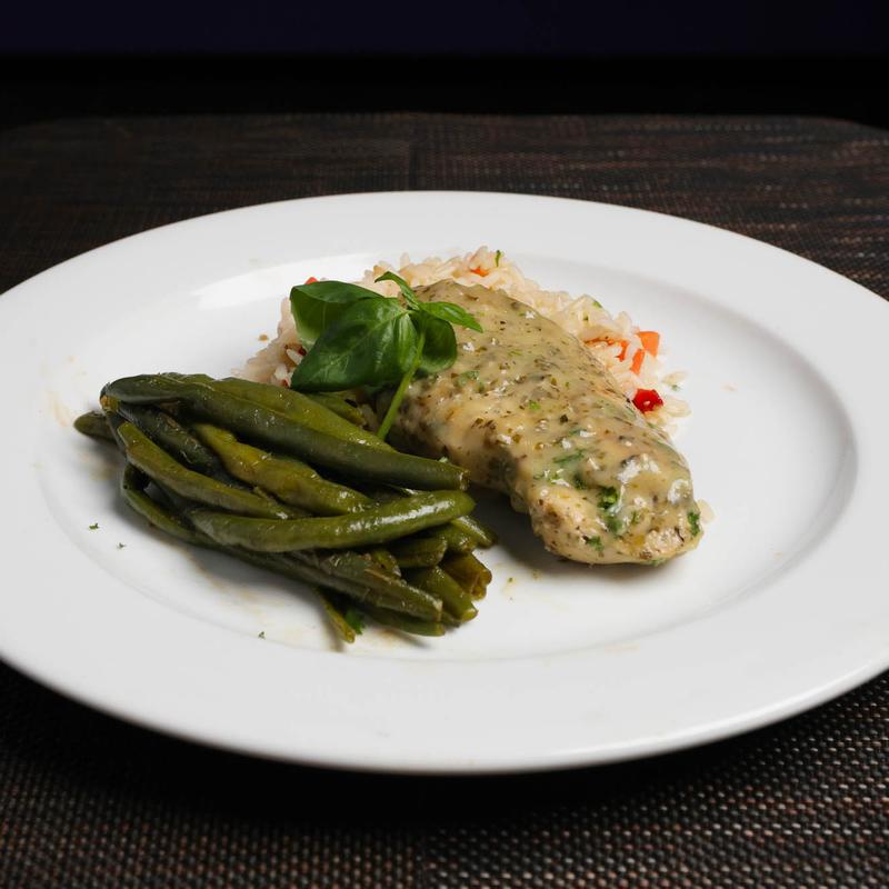 Marinated Grilled Chicken Breast Topped with a Pesto Cream Sauce photo