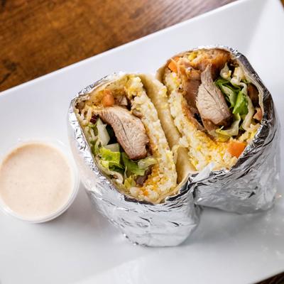 Fusion Burrito and a sauce on the side.