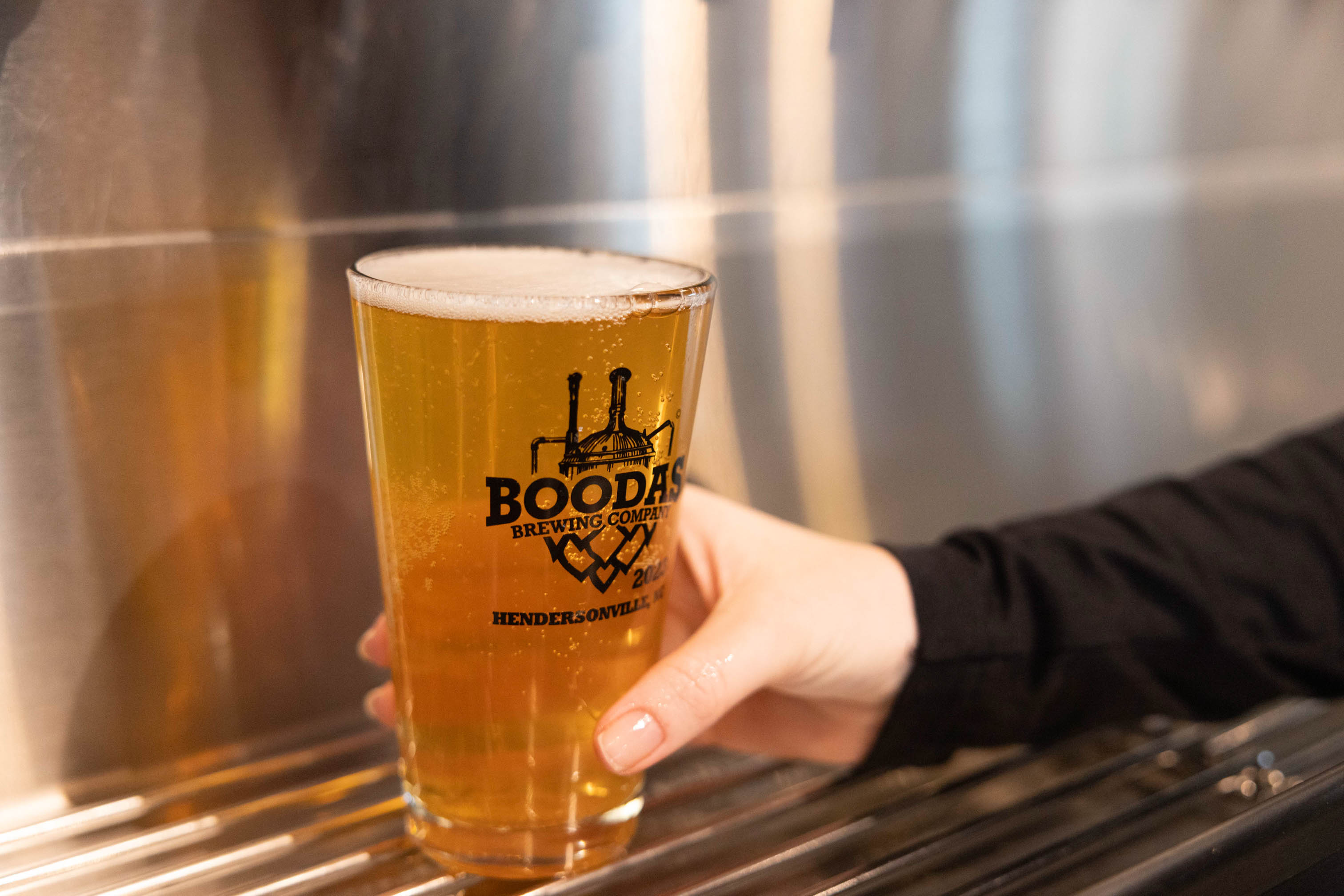 A pint glass of beer from Boodas