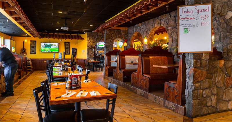 Interior, lined up dining tables and booths