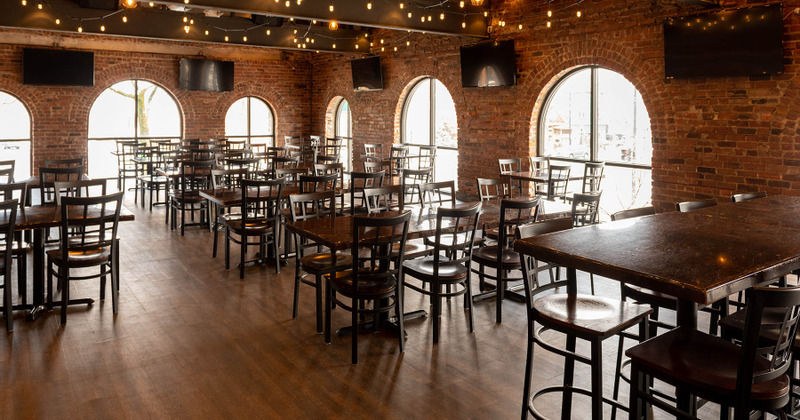 Interior, bar area with TVs behind it