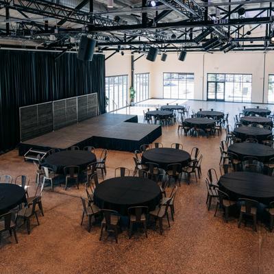 Interior, seating area with a stage.