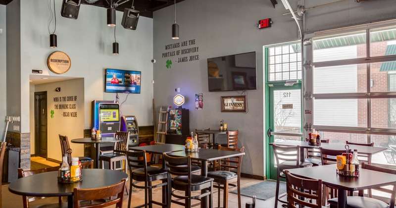 Diner area, tables and chairs, tv on the wall