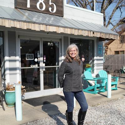 The owner standing outside the restaurant.