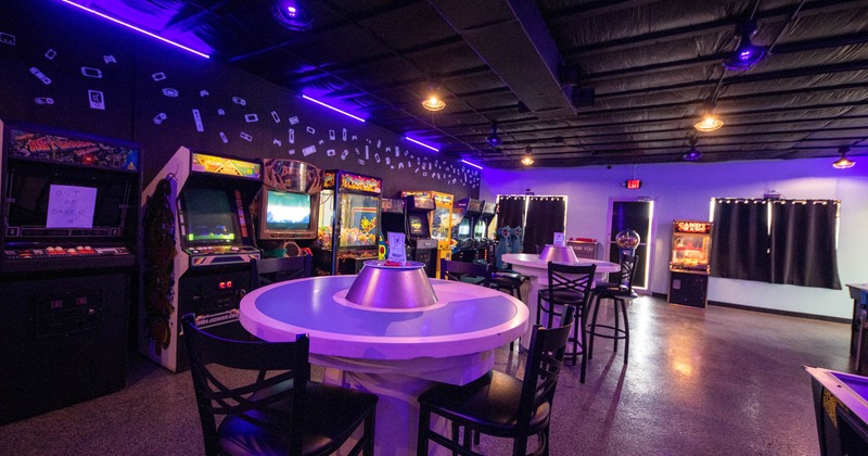 Different arcade game machines and seating