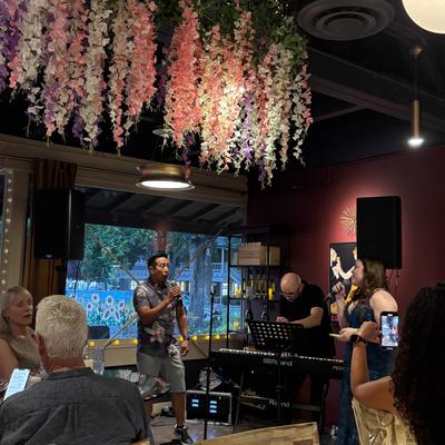 Singers performing on stage.