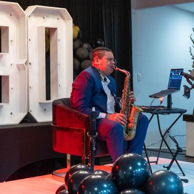 Musician playing saxophone.
