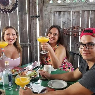 Three guests posing for a photo.