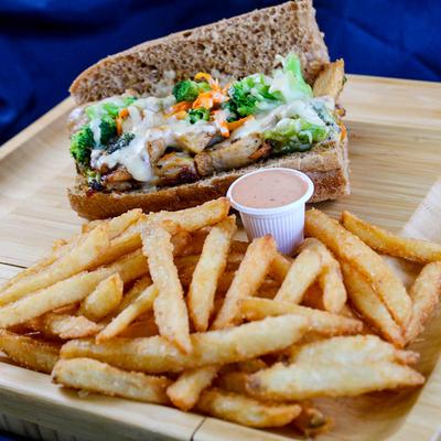California Chicken Sub, fries, and a small cup of sauce for dipping.