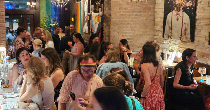 Guests at a party. Crowded bar area.