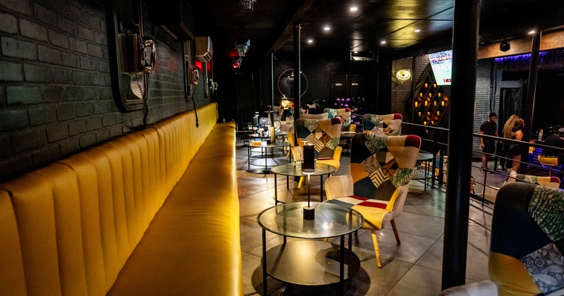 Interior, long banquet bench, tables and chairs