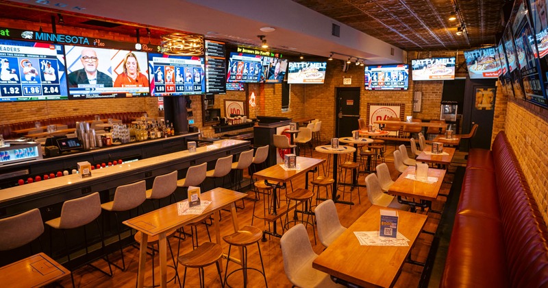 Interior, seating area, TV screens on the wall