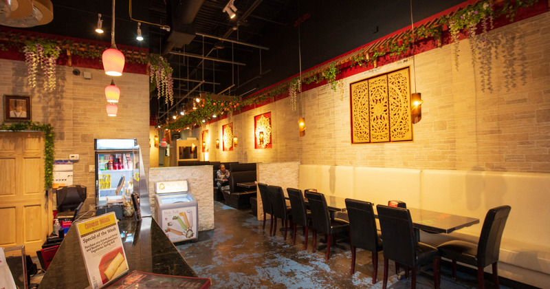 Checkout counter on the left and tables on the right