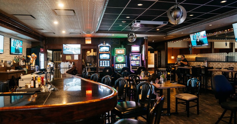 Interior, dining and bar areas, slot machines in the background