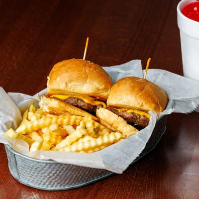 Two kids cheeseburgers served with crinkle-cut fries and Kids Shirley Temple drink.