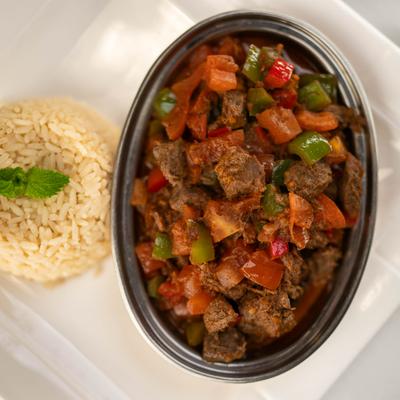 Sauteed meat stew with peppers and rice.