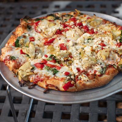 Special Veggie Pizza on a metal tray.