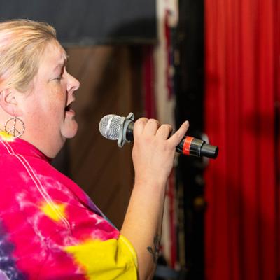 A person singing into the microphone.