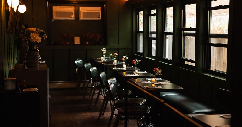 Interior, dining area with tables set for guests