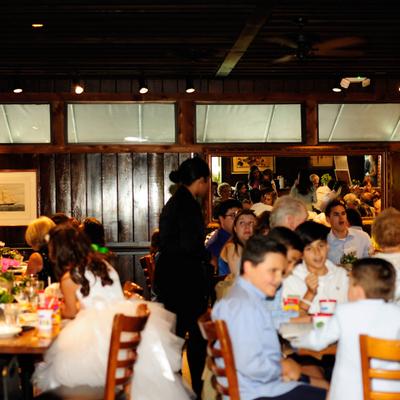 People siting at tables in the restaurant.