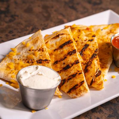 Chicken Quesadillas, served with salsa and sour cream.