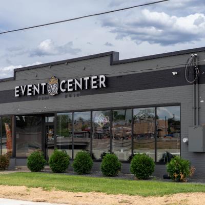 A modern, grey building labeled 