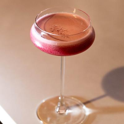 Gin, egg white, and Bavaroise Syrup cocktail.