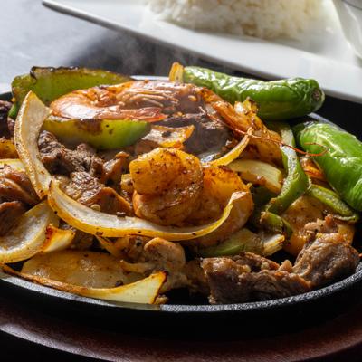 Chicken, shrimp, and steak Fajitas.