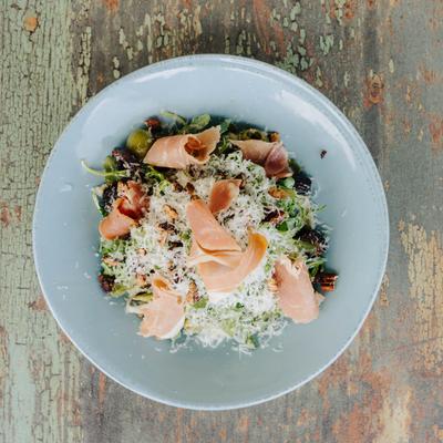 Fig and Olive salad with prosciutto, arugula, Parmesan, and olives.