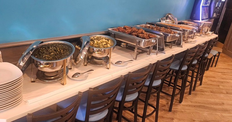 Buffet tables with chafing dishes of food