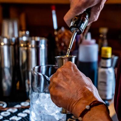 Bartender making a cocktail.