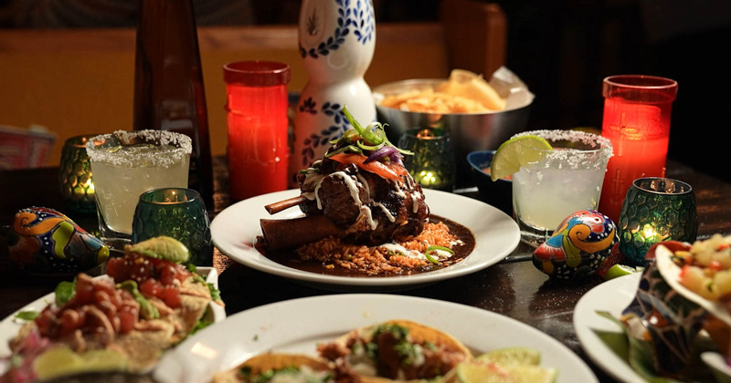 Traditional preparation of carnitas, bathed in 7 chili sauce