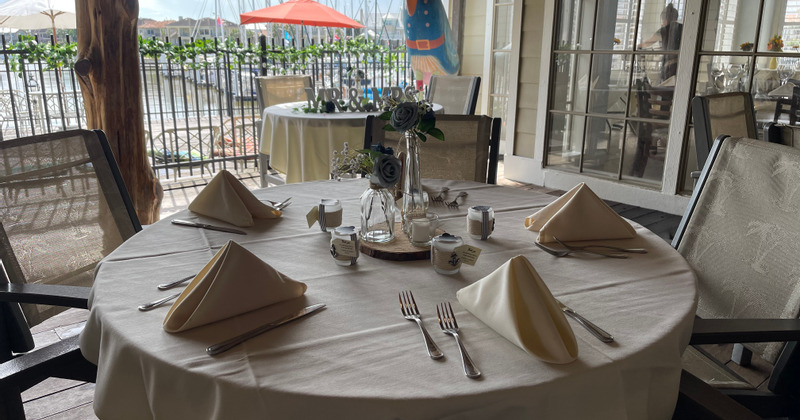 Interior, a table with white table cloth, cutlery and dining napkins