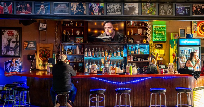 A person sitting at the bar