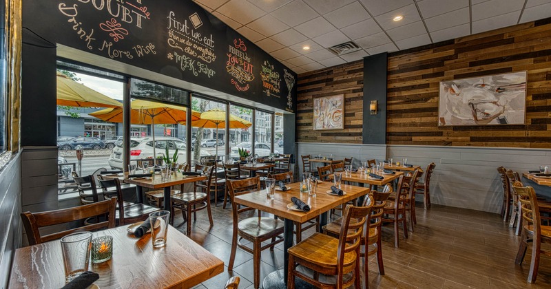 Interior, dining area, tables for two and four people, ready for guests, shop window