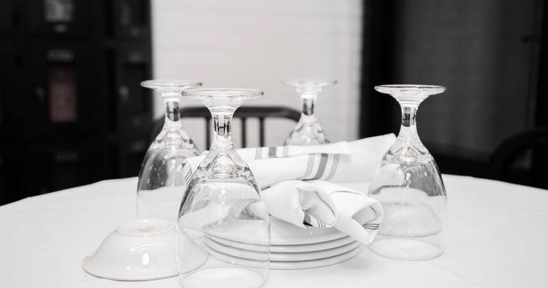 Interior, tableware, cutlery and wine glasses on a table, closeup