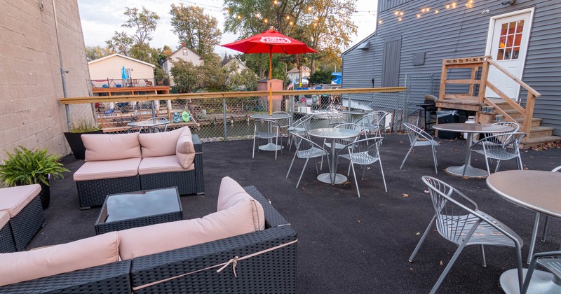 Patio, tables, chairs couch, parasols