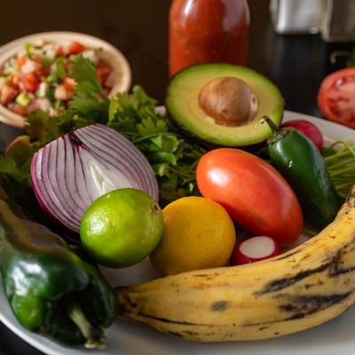 A plate with vegetables and fruits.