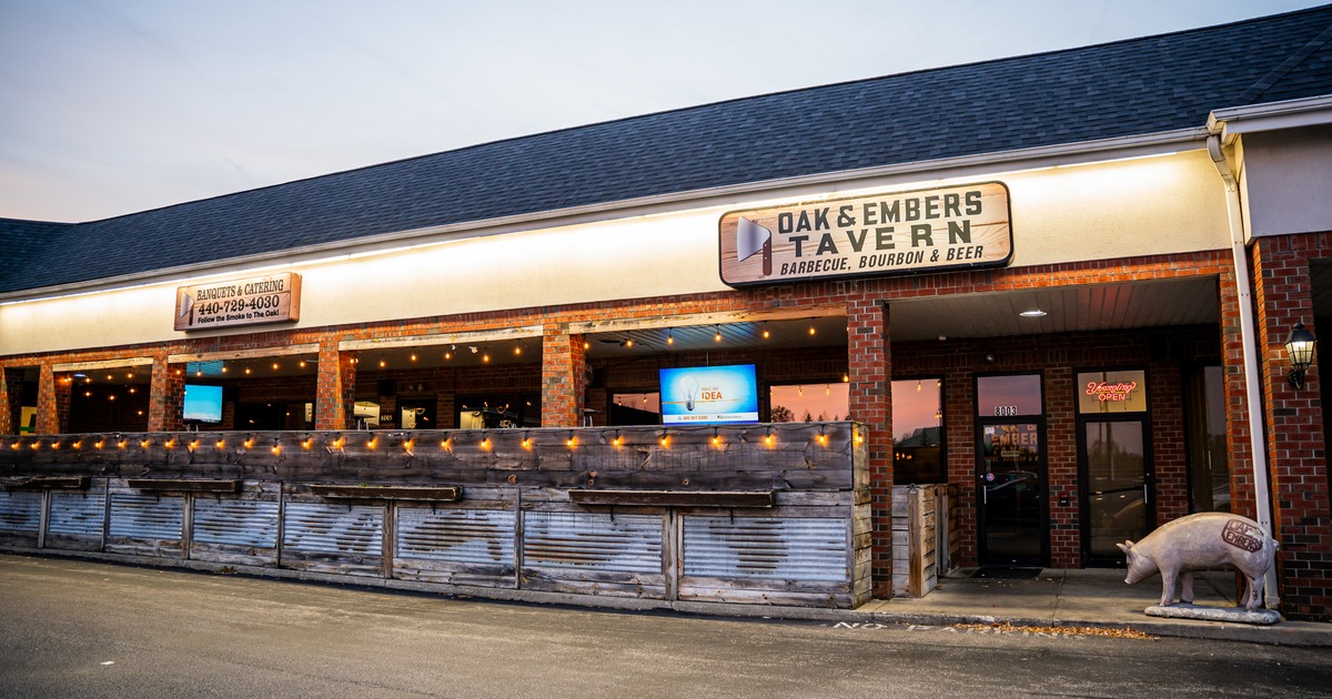 Exterior, front view to restaurant, part of parking lot