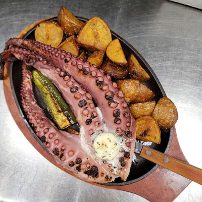 Grilled octopus served with crispy potatoes, grilled jalapenos and onions.