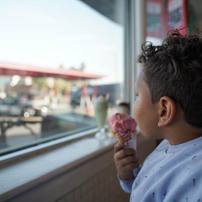 customer eating strawberry ice cream cones.