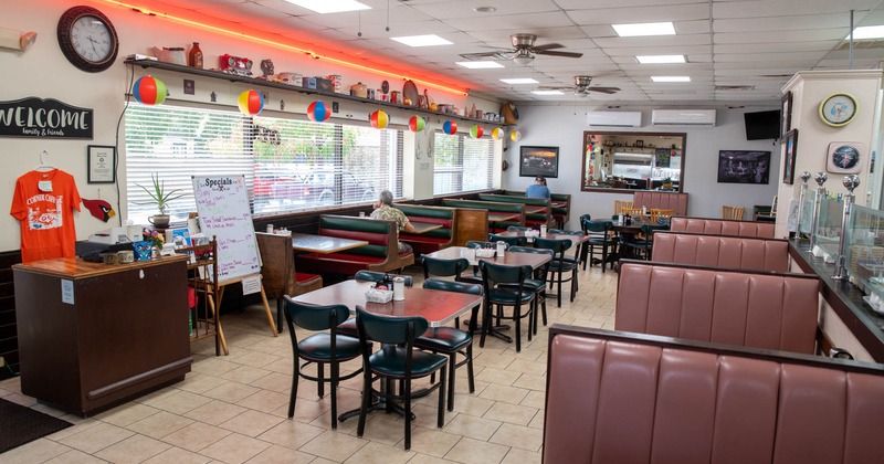 Interior, tables on the left and restaurant booths on the right