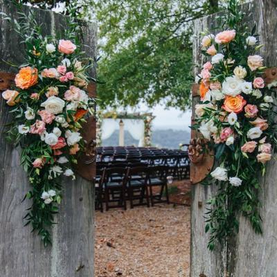 Flower arrangements and seating outside.